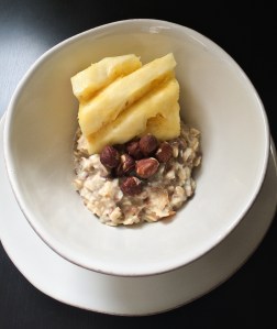 Vegan Muesli topped with hazelnuts and pineapple